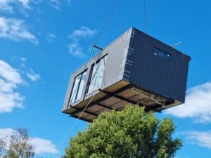 A sleek modern modular home with large windows in Turkey, showcasing contemporary architecture.